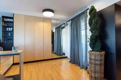 a living room with a table and a plant at Athens Skyline Loft in Athens