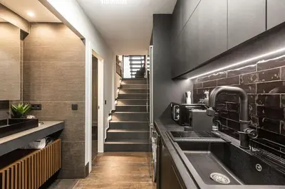 a kitchen with a sink and a staircase at BookRoom in Athens