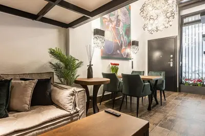 a living room with a couch and a table at BookRoom in Athens