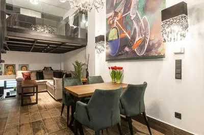 a dining room with a table and chairs at BookRoom in Athens