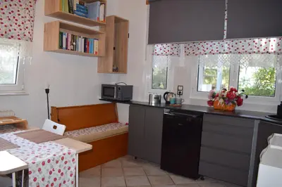 a kitchen with a table and a counter top at h2h Chris # Μικρό, φωτεινό & βολικό σπίτι in Athens