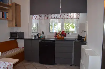 a kitchen with a sink and a counter top at h2h Chris # Μικρό, φωτεινό & βολικό σπίτι in Athens
