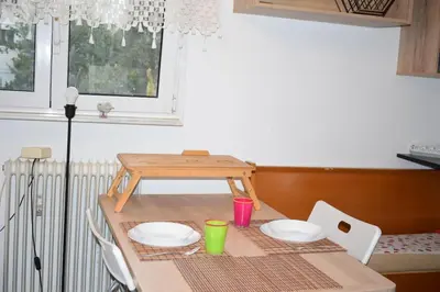 a table with plates and cups on top of it at h2h Chris # Μικρό, φωτεινό & βολικό σπίτι in Athens