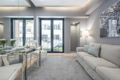 a living room with a couch and a table at Charming apartment in Kolonaki, Peridot - Homes in Athens