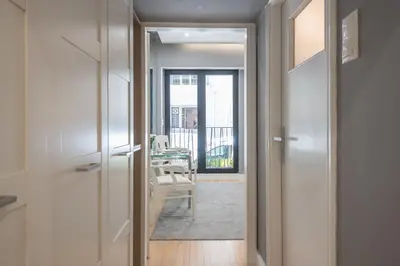 a hallway with a door leading into a living room at Charming apartment in Kolonaki, Peridot - Homes in Athens