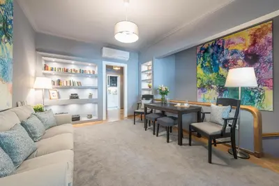 a living room with a couch and a table at Luxurious apartment in Kolonaki, Peridot -Homes in Athens