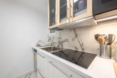 a kitchen with a sink and a counter top at Luxurious apartment in Kolonaki, Peridot -Homes in Athens