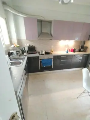 a small kitchen with a sink and a stove at SAILORS LUXURY APPARTMENT 130m2 in Athens