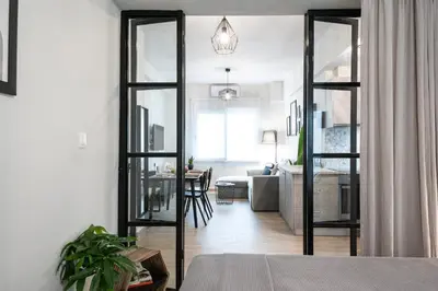 a living room with a large glass door leading to a living room at apt Seventeen_2-bedroom flat_Athens citycentre in Athens