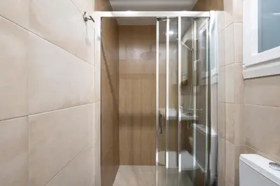 a glass shower in a bathroom with a toilet at apt Seventeen_2-bedroom flat_Athens citycentre in Athens