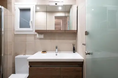 a bathroom with a sink and a toilet at apt Seventeen_2-bedroom flat_Athens citycentre in Athens