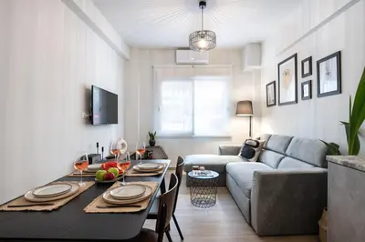 a living room with a table and a couch at apt Seventeen_2-bedroom flat_Athens citycentre in Athens