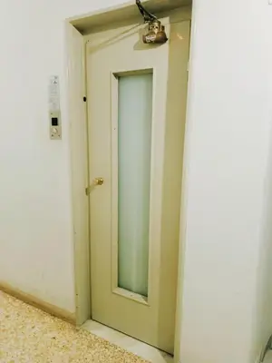 a door in a room with a mirror at Sweet home in Athens in Athens