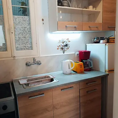 a kitchen with a sink and a counter top at Sweet home in Athens in Athens