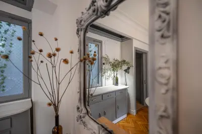 a mirror in a room with a vanity and a window at Friends & family 3broom apt, downtown Athens-FIX in Athens