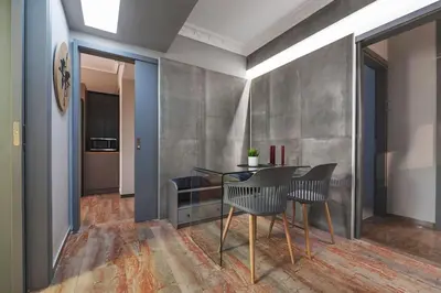 a dining room with a table and chairs at Beautiful apt in Glyfada Center, Papandreou Street in Athens