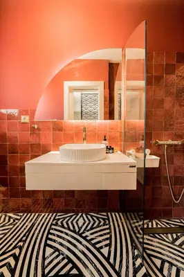 a bathroom with a sink and a mirror at Sky Apt Unique, Spotless, 2BR, 2BA, Stunning View in Athens