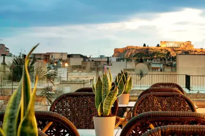 a table and chairs with a view of a city at Zeus Essence Athens Central, former Athens Key in Athens