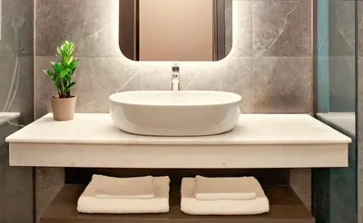 a bathroom with a sink and a mirror at Zeus Essence Athens Central, former Athens Key in Athens