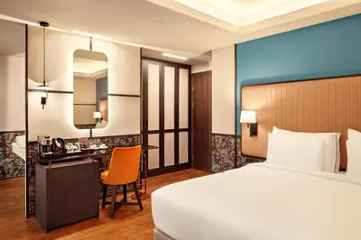 a hotel room with a bed and a desk at Zeus Essence Athens Central, former Athens Key in Athens