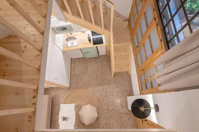 an overhead view of a room in a wooden house at Stoa Kairi Loft A in Athens