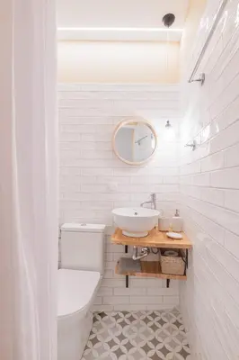 a white bathroom with a sink and a toilet at Stoa Kairi Loft A in Athens