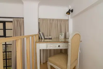 a desk with a chair in a room at Stoa Kairi Loft A in Athens