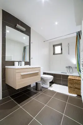 a bathroom with a sink and a toilet and a tub at Lovely New Βuild Flat Near Metro - Free Parking in Athens