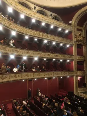 an auditorium of an opera house with people sitting at Royal Red suite No2 PIRAEUS PORT in Piraeus