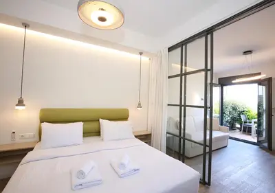 a bedroom with a bed with two towels on it at Emily in Athens - Central chic flat with terrace Syntagma E1 in Athens