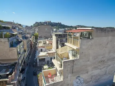 an aerial view of a city with buildings at Wake up with Acropolis view! in Athens