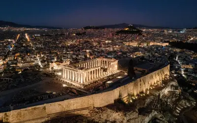 an aerial view of the acropolis at night at Acropolis Holmes Residence in Athens