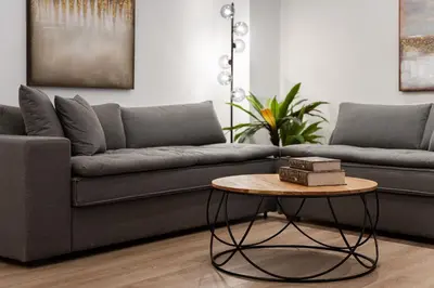 a living room with a couch and a table at Acropolis Holmes Residence in Athens