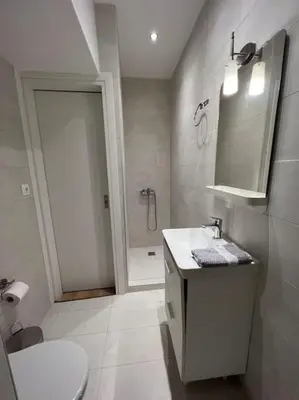 a bathroom with a toilet and a sink and a shower at Luxury Studio “Atene” in Athens