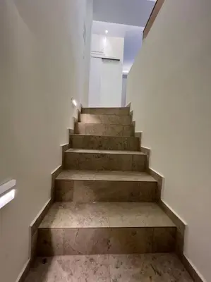 a staircase in a building with a stair case at Luxury Studio “Atene” in Athens