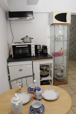 a kitchen with a table with plates on it at Boutique Kalithea in Athens