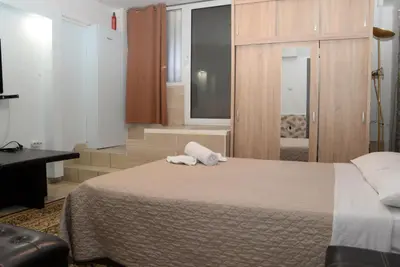a hotel room with a bed and a window at Boutique Kalithea in Athens