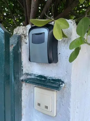 a tv sitting on the side of a wall at Near sea / Airport, Queen size bed, Fireplace in Artemida