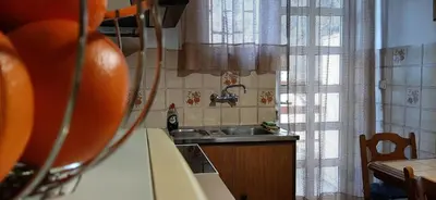 a small kitchen with a sink and a window at Koukaki View in Athens