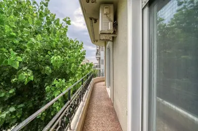 a balcony of a building with a window at Charming Contemporary 2 bedroom apartment in Athens
