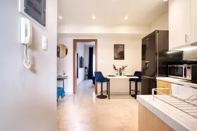 a kitchen with a table and chairs in a room at Blue Horizon - City Center Close to Metro in Athens