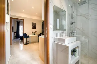 a bathroom with a sink and a shower at Blue Horizon - City Center Close to Metro in Athens
