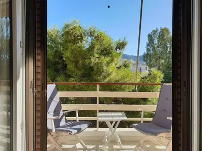 two chairs and a table on a balcony at Rooftop Studio Apt - 5 Min Walk to Holargos Metro in Athens