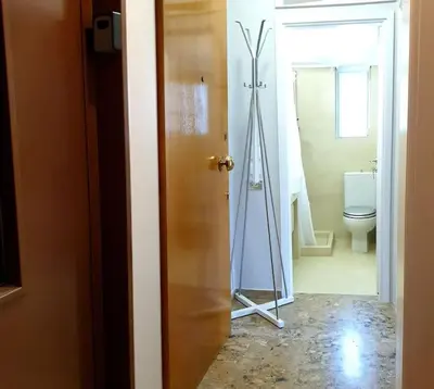 a room with a bathroom with a mirror and a toilet at Rooftop Studio Apt - 5 Min Walk to Holargos Metro in Athens
