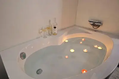 a white bath tub with candles in it at Santorini Style at Nathional Archeological museum of Athens,Greece in Athens
