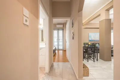 a hallway leading to a living room and dining room at Pegasus Apartment in Piraeus