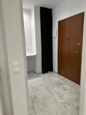 a room with a door and a tile floor at Palace Apartment in Athens