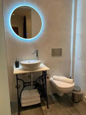 a bathroom with a sink and a toilet at Palace Apartment in Athens