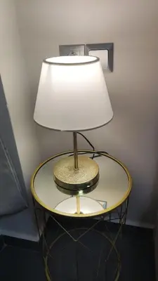 a table with a lamp on top of it at Ermou Downtown Suites by Athens Urban Retreat in Athens