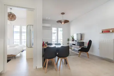 a kitchen and living room with a table and chairs at 2bdroom Plaka Apartment in Athens